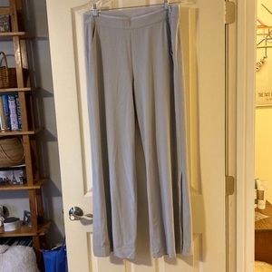 Grey Athleta pants with size zipper and snap opening on legs. Size 12